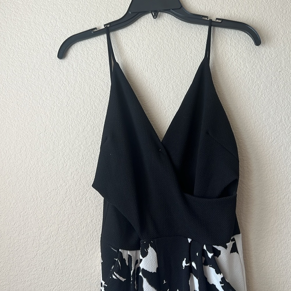 Floral legged, pant suit romper. Spaghetti strap.